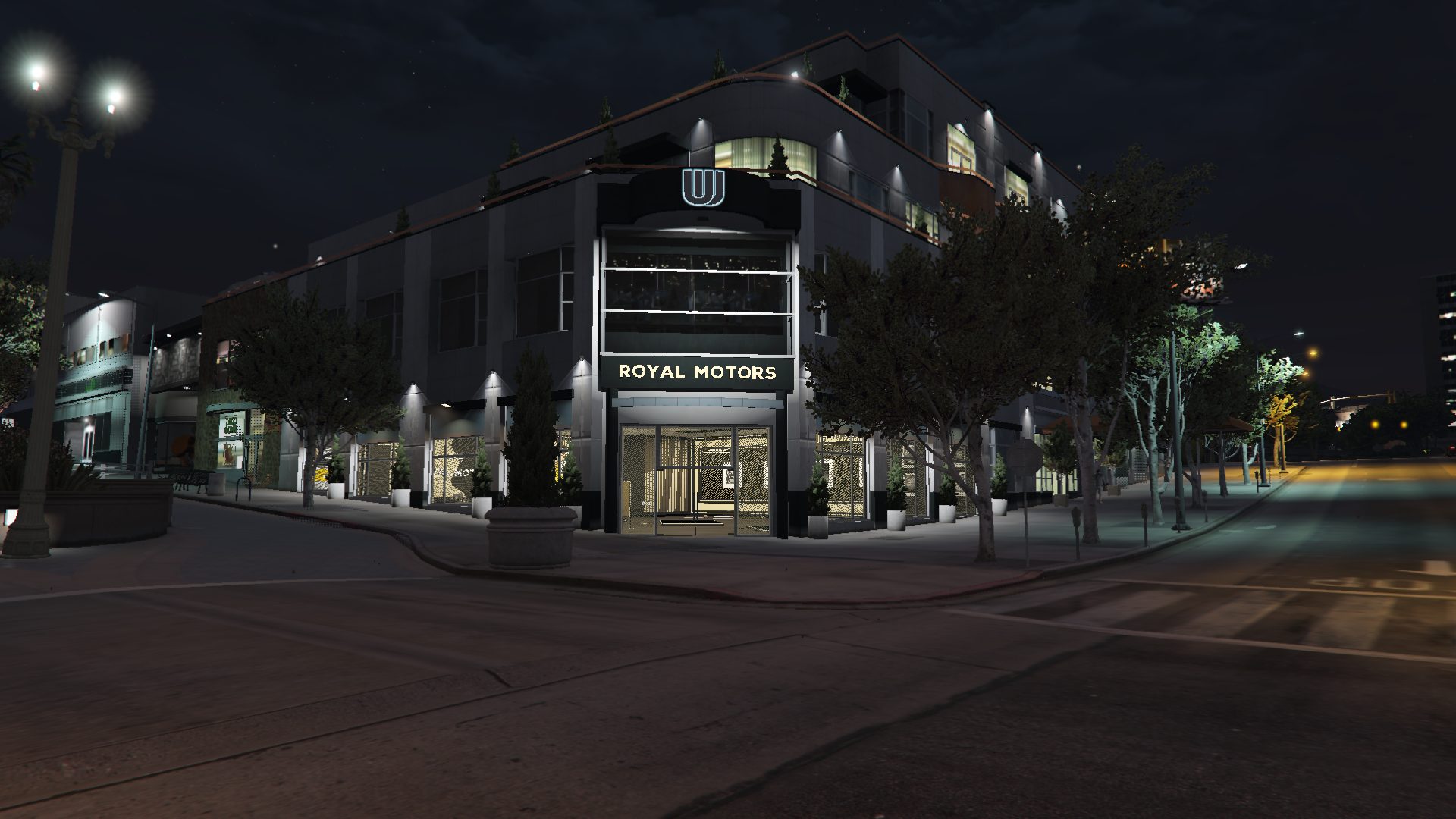 Royal Motors dealership storefront at night