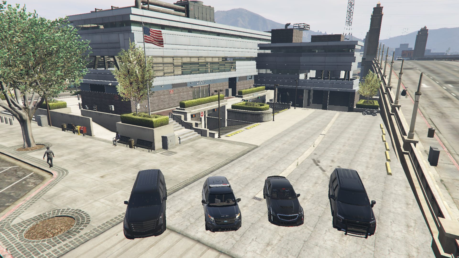 Los Santos Police Department exterior with cruisers parked outside